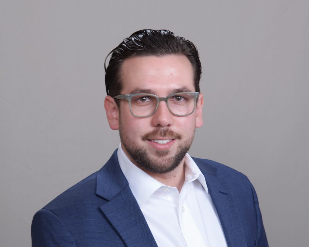 Corporate bio photo of Dimitri Madden.