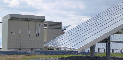 Photovoltaics connect to the local power grid via inverters (background).