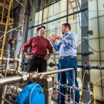 Sandia researcher Bobby Middleton, right, has developed a more efficient cooling system for power plants. Together with Patrick Brady, left, the researchers are also developing a first-of-its kind systems dynamics analysis to identify water-saving technologies for cooling at power plants.