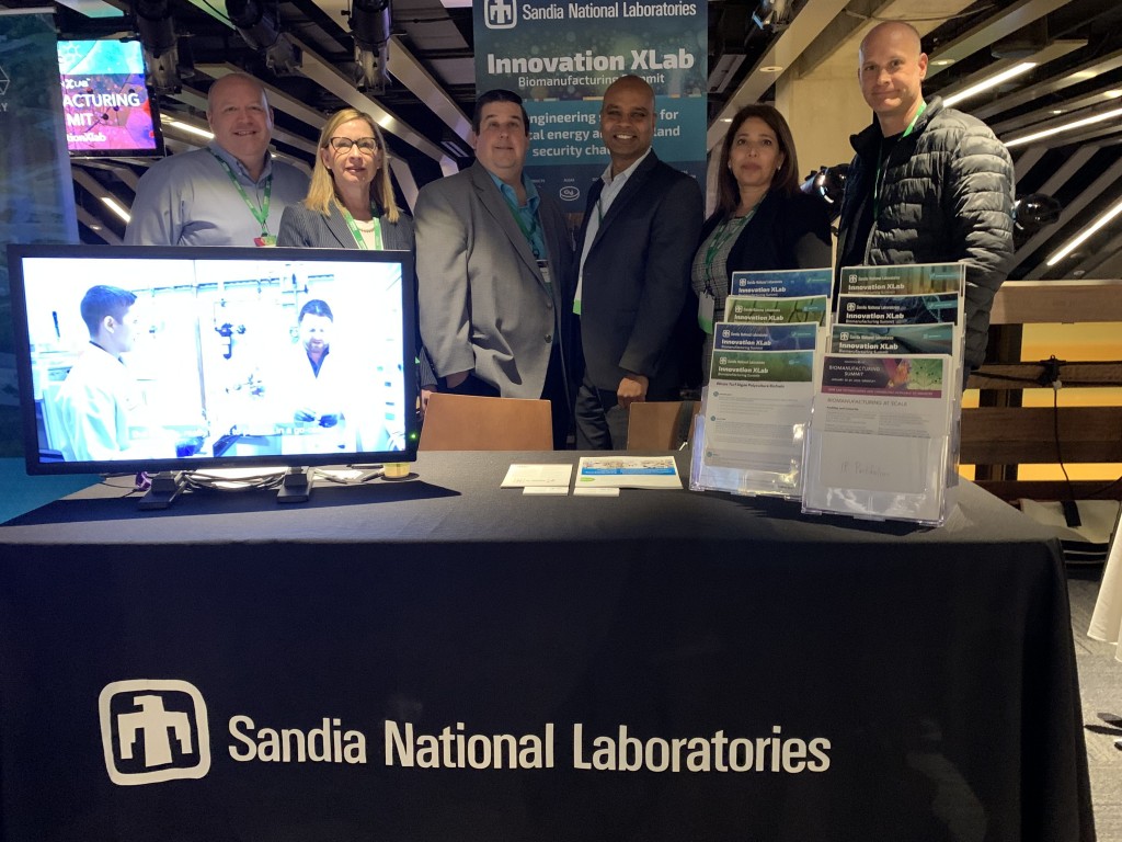 Sandia scientists at the booth at XLab