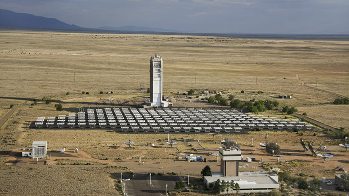 The solar tower with the desert in the background