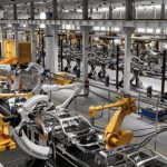 robotic arms assemble a product in a factory