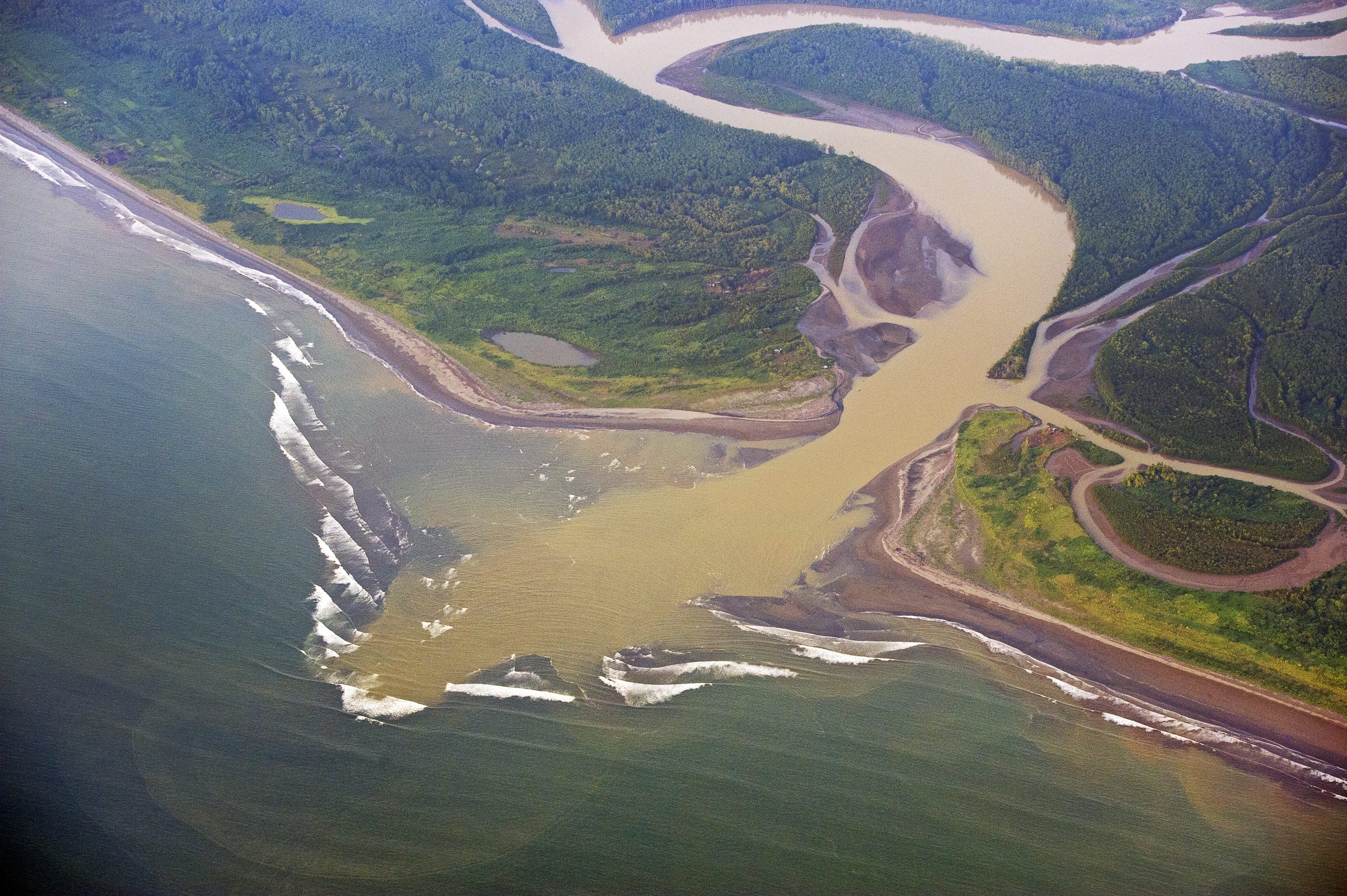 Silt outwash from river, Oso Peninsula, Corcovado coastal Costa Rica